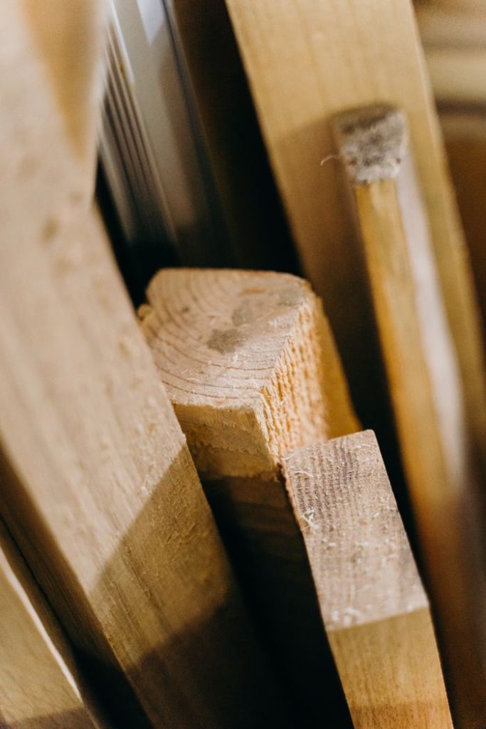 A vertical close-up shot of textured wooden planks showcasing natural patterns.